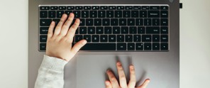 hands on a computer keyboard